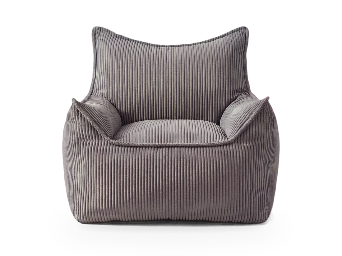 Pouf fauteuil en velours côtelé gris vu de face, dossier et accoudoirs à oreilles